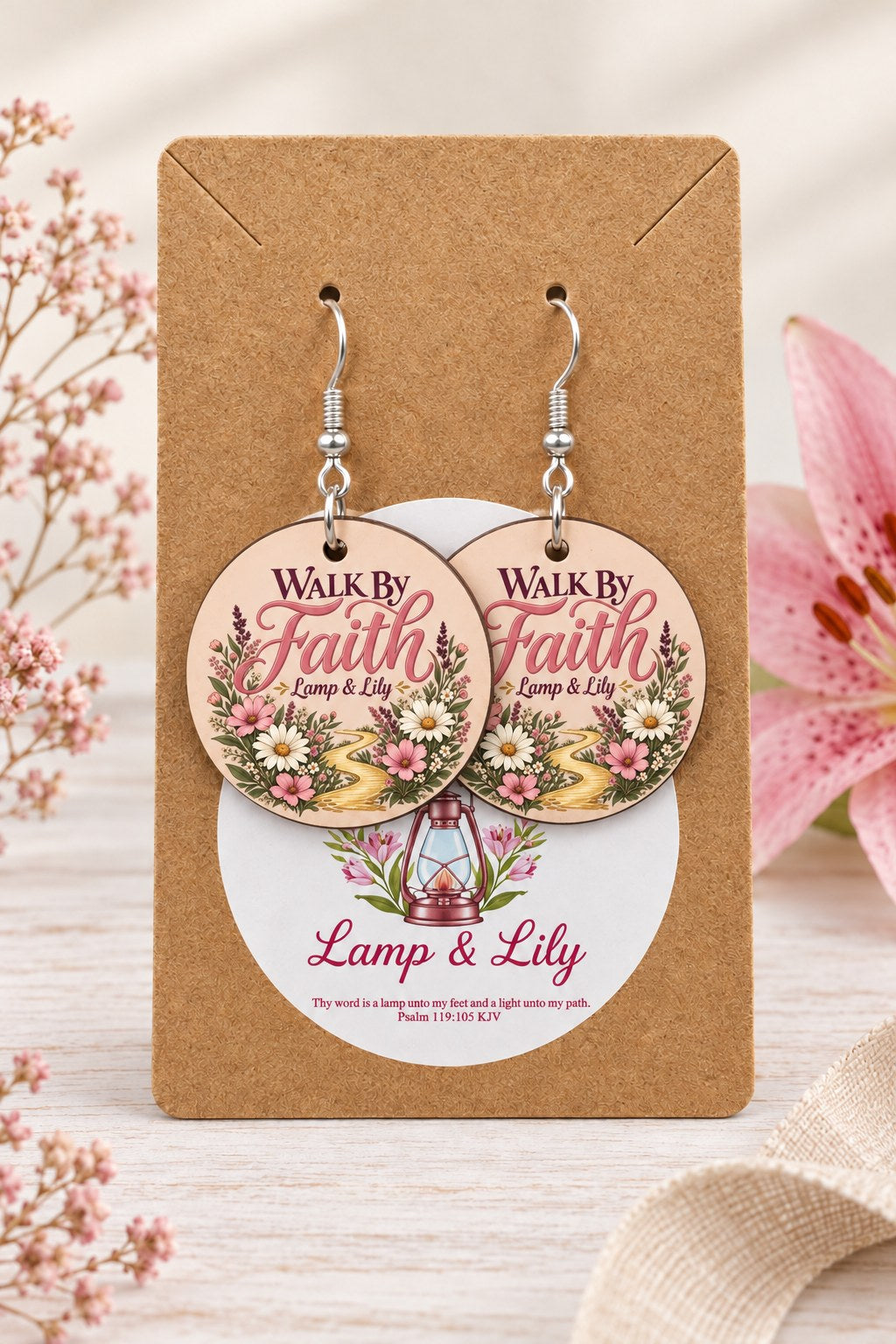 Walk by Faith round Lamp & Lily earrings on silver hooks displayed on a kraft earring card