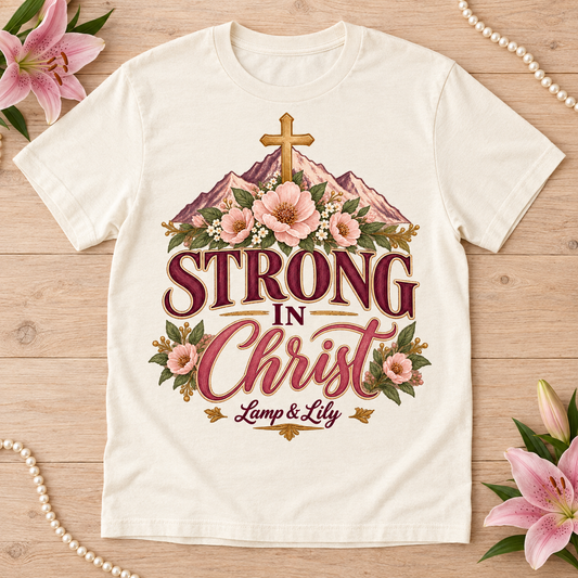 Strong in Christ Lamp & Lily tee with a floral faith design, inspired by Philippians 4:13