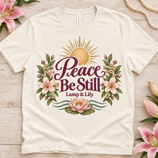 Peace Be Still Lamp & Lily tee with a floral faith design, inspired by Isaiah 26:3
