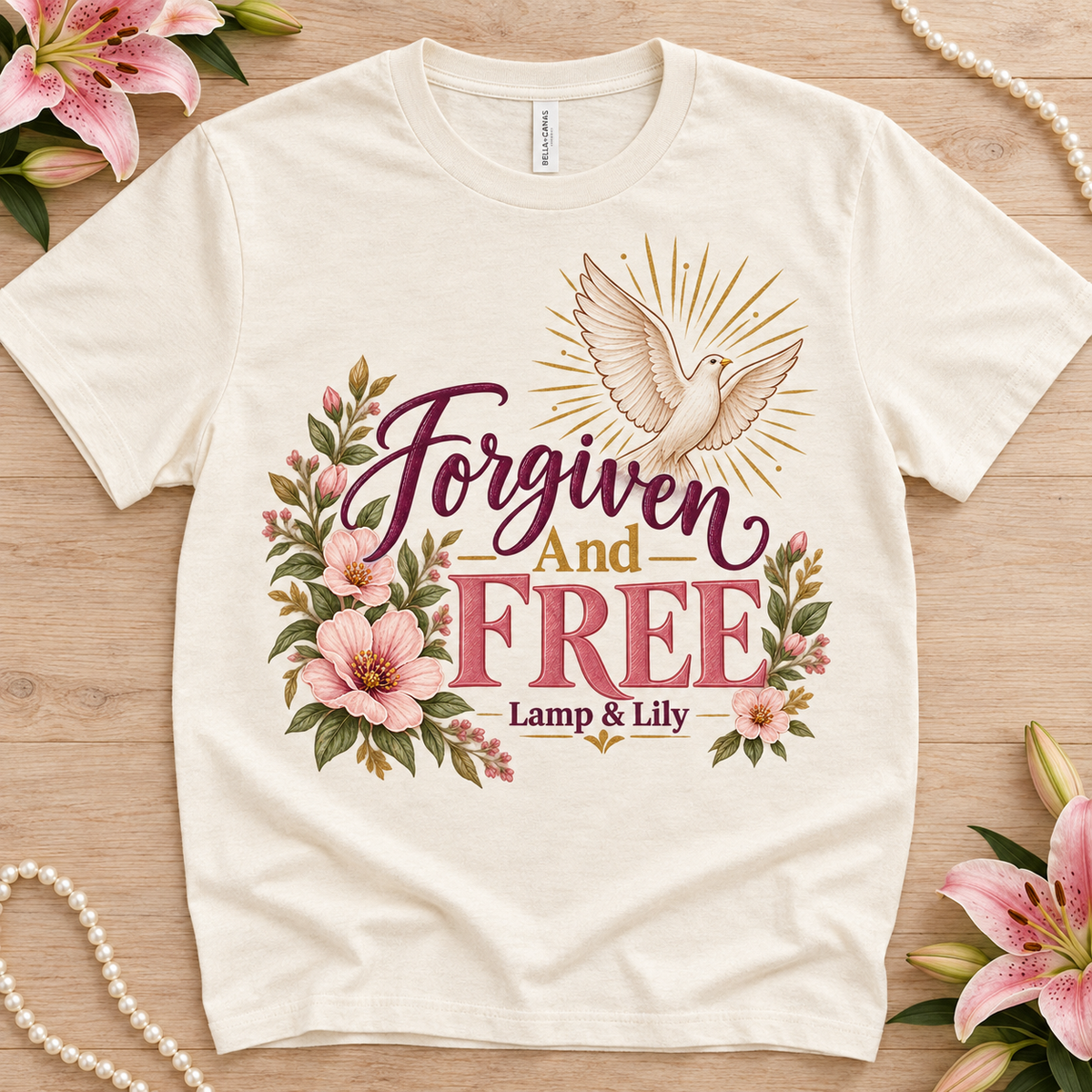 Forgiven and Free Lamp & Lily tee with a floral faith design, inspired by 1 John 1:9