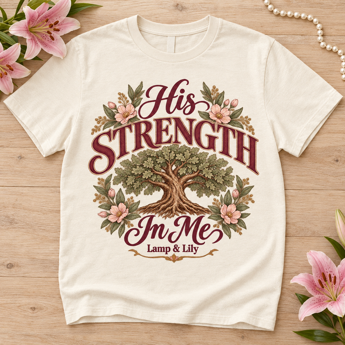 His Strength in Me Lamp & Lily tee with a floral faith design, inspired by Isaiah 40:31