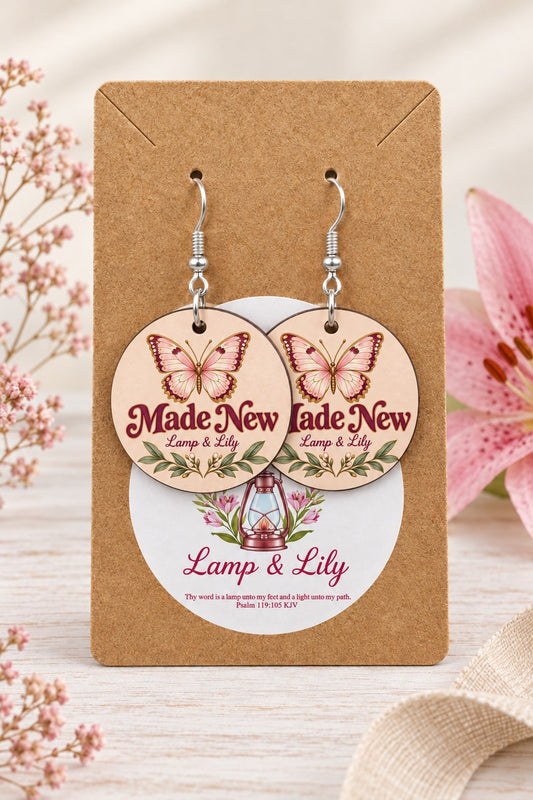 Made New round Lamp & Lily earrings on silver hooks displayed on a kraft earring card