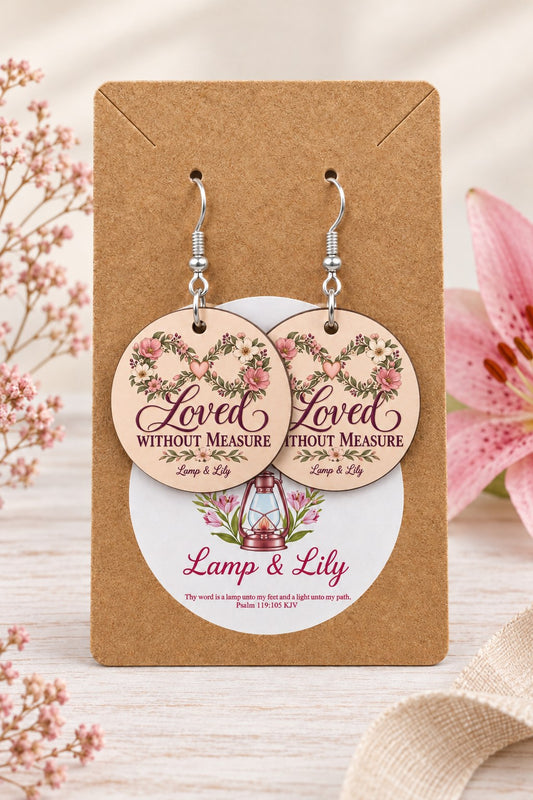 Loved without Measure round Lamp & Lily earrings on silver hooks displayed on a kraft earring card