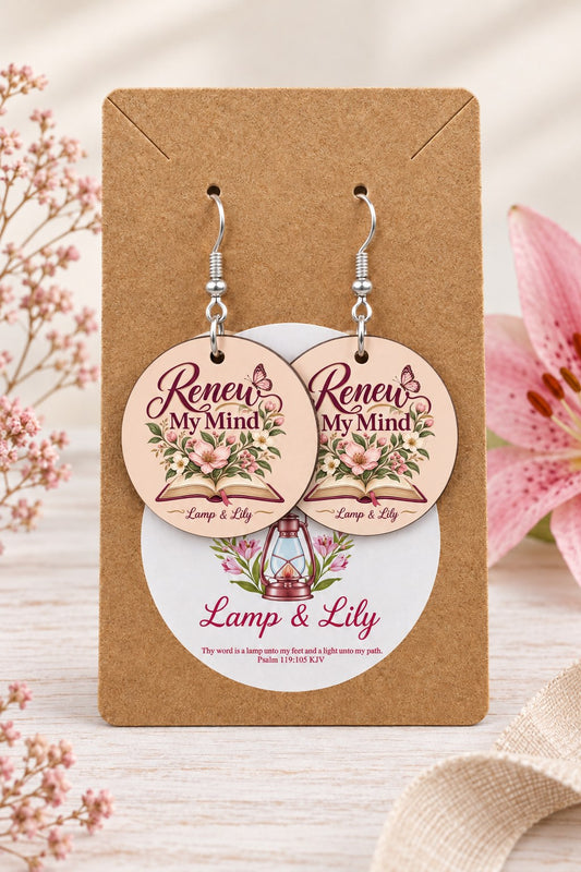Renew my Mind round Lamp & Lily earrings on silver hooks displayed on a kraft earring card