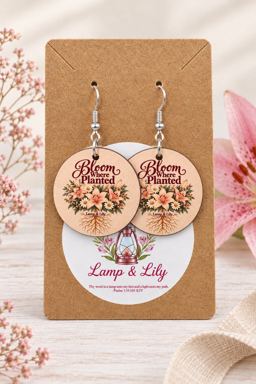 Bloom Where Planted round Lamp & Lily earrings on silver hooks displayed on a kraft earring card