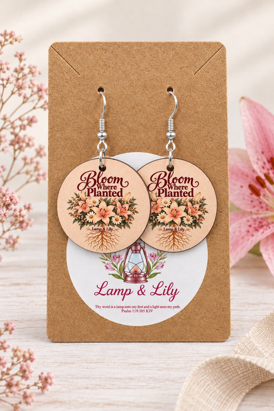 Bloom Where Planted round Lamp & Lily earrings on silver hooks displayed on a kraft earring card