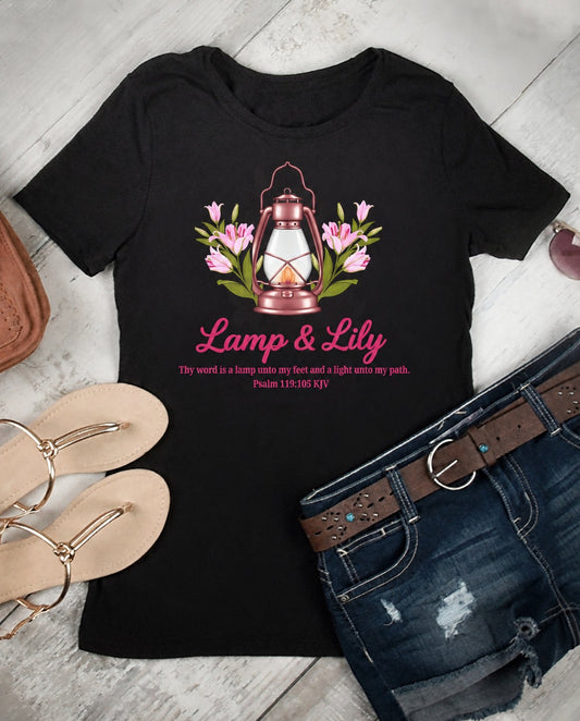 Black Lamp & Lily faith graphic tee with rose-gold lantern, pink lilies and Psalm 119:105 KJV verse
